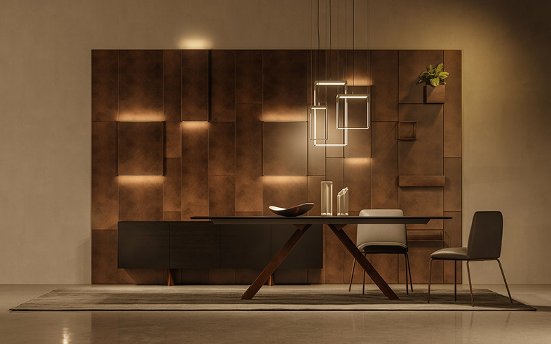 Boiserie Magnetika di Ronda Design ambientata in salotto con pareti tinta scura, tavolo e sedie